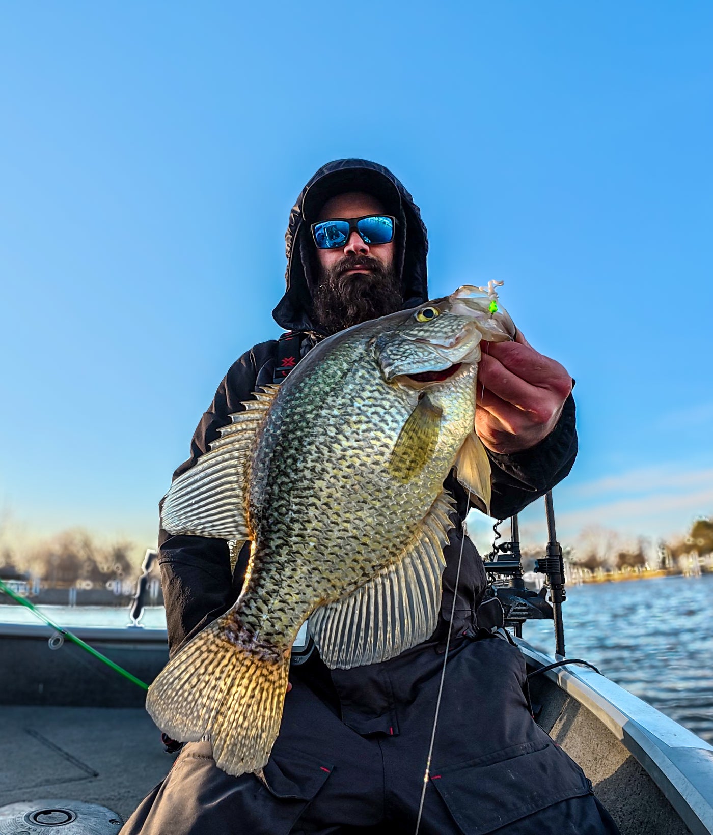 Angler holding a large crappie caught on Panfish Slayers gear
